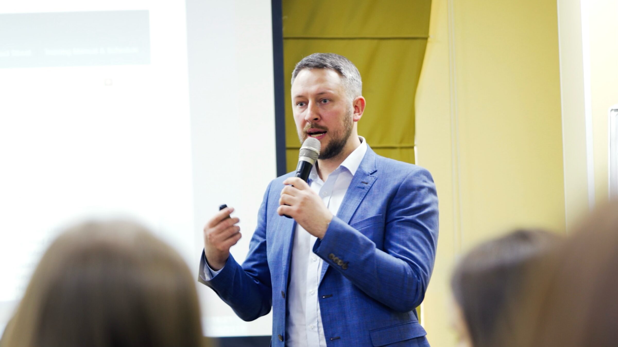 Suited man presenting